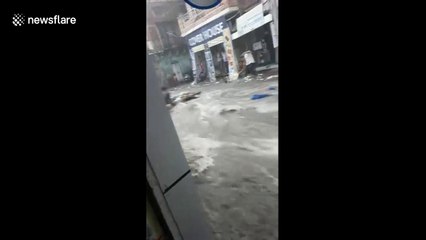 Man heroically steps into raging waters to save little girl