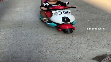 small boy riding a bike with his girl friend