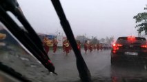 Philippine locals conduct religious march through ankle-deep floodwaters during severe typhoon