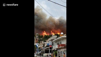 Flames lash hillside above town as death toll 'hits 60'