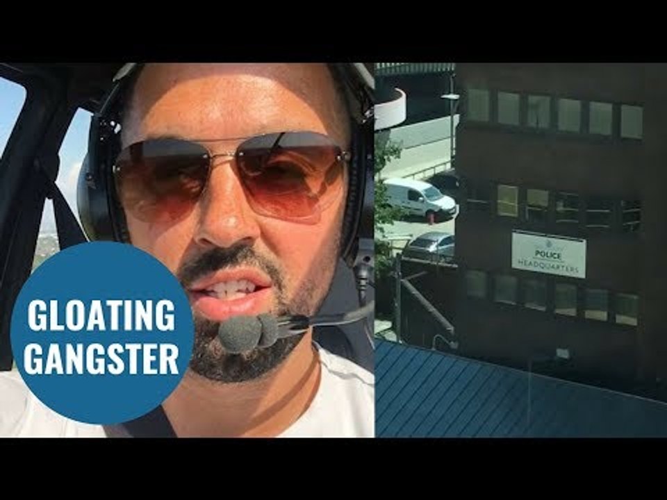 Fugitive taunts cops by posing outside a police HQ