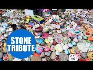 Painted stones have been laid at a bandstand in memory