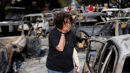 Greece fires: Twenty-six people found dead hugging each other in a field