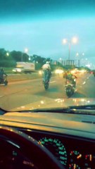 Group of Motorcyclists Do Stunts on Expressway