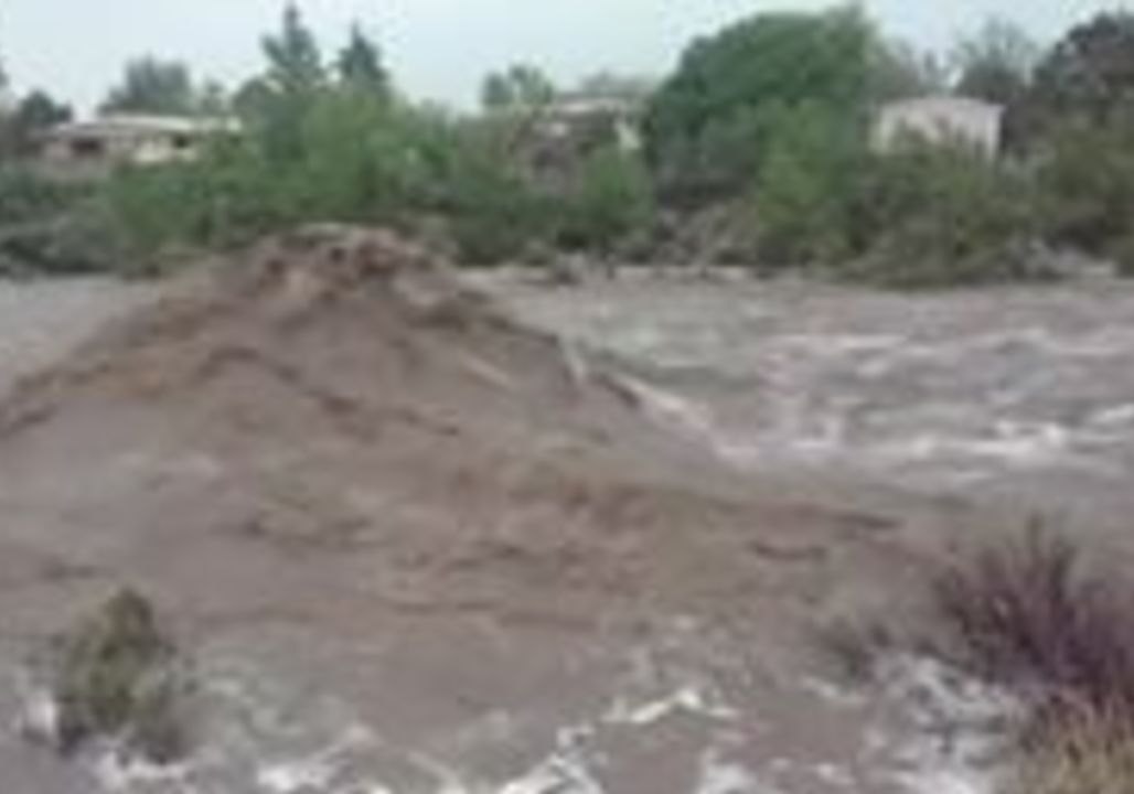 Raging Floodwaters Rush Down Normally Dry Riverbed in Santa Fe