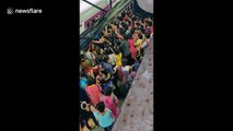 Women battle rush-hour crush to get into Mumbai train