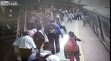 Woman slips under moving train, alert cop saves her