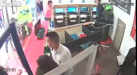 Crazy man repeatedly stabs another man and his girfriend at internet café
