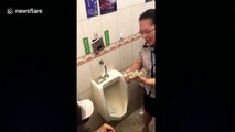 Chinese employee devours food from urinal to prove how clean it is