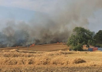 Fire Burns Through Fields Next to Drusillas Zoo Park in East Sussex