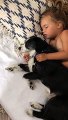 Siblings cuddle with rescue dog for nap time