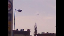 007a.SLOW MOTION UFO RED DEER ALBERTA CANADA. LOOK BETWEEN THE LIGHT POST.THIS IS THE ORIGINAL VIDEO SLOWED DOWN SO YOU CAN SEE THE UFO BETTER.UNIDENTIFIED FLYING SAUCER.