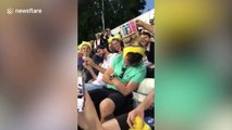 Funny moment cricket fans stack drinks on a sleeping fan