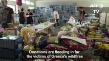 Donations and volunteers flood in for Greek fire victims