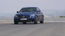 The new Mercedes-AMG C 63 S Sedan in Brilliant blue Driving on the track