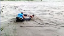 NDRF personnel rescue people stranded in flooded river | OneIndia News