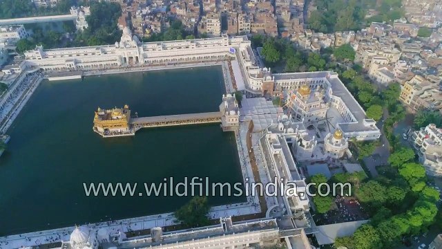 Fly over Amritsar- Golden Temple old city railway station and trains from the air
