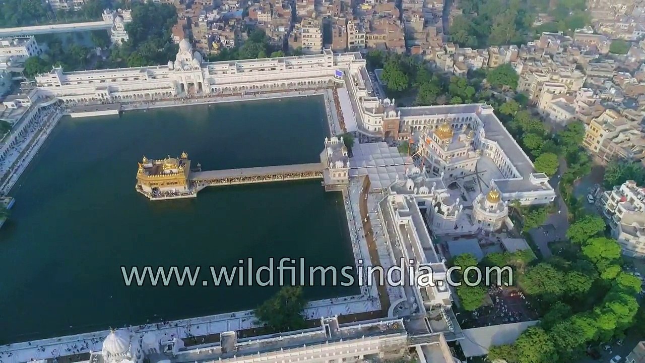 Fly over Amritsar- Golden Temple  old city railway station and trains from the air