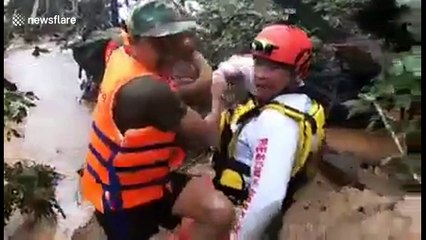 Moment four-month-old baby is rescued from Laos flood