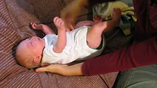 One month old demonstrates newborn reflexes