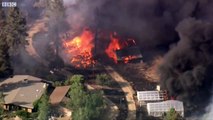 California wildfire tears through homes - BBC News
