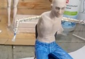 Sculptor Creates a Lifelike Figure of John Lennon