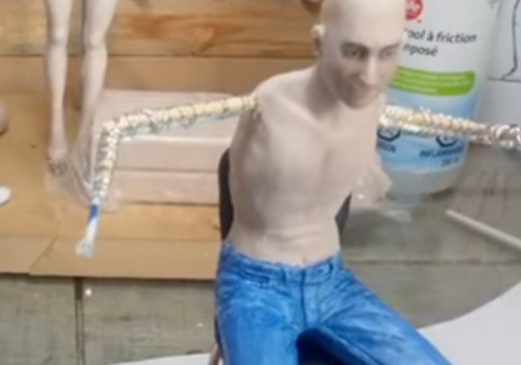 Sculptor Creates a Lifelike Figure of John Lennon