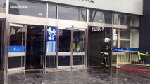 Torrential rain causes flooding at a shopping centre in Stratford, London
