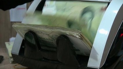 Iran's rial plunges to record low