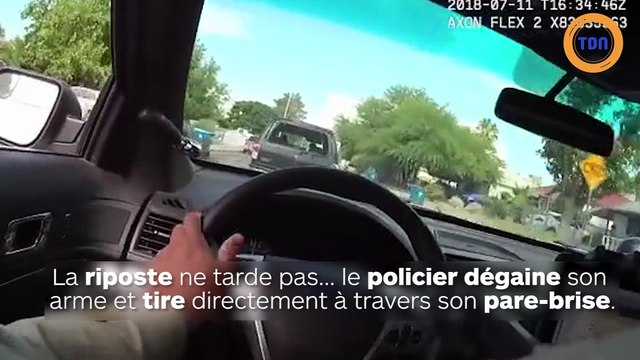 Un policier tire à travers son pare-brise pour arrêter des suspects !