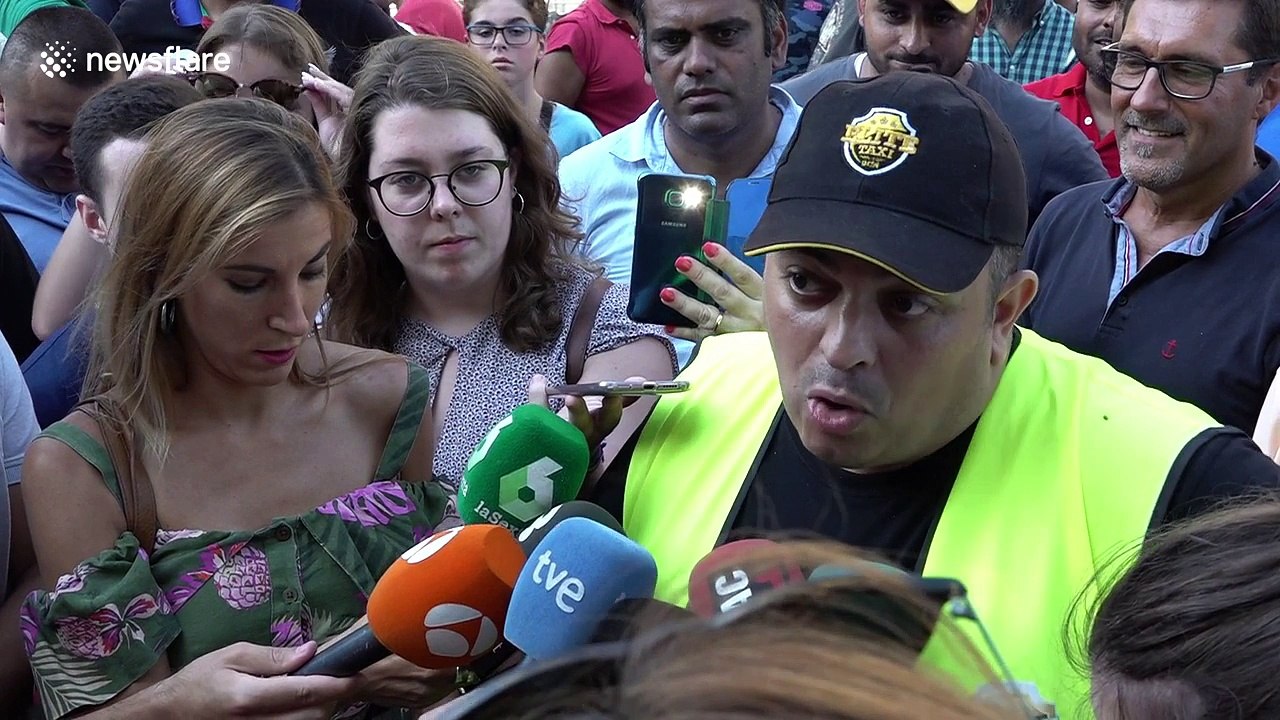 Spanish taxi drivers call strikes nationwide over Uber and Cabify