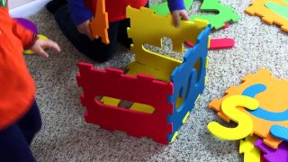 Making big box with ABC squishy puzzle. Kids playing inside a big alphabet box. Lets play