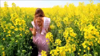 Young Woman in Vintage Dress Running Field Touching Flowers HD Stock Footage