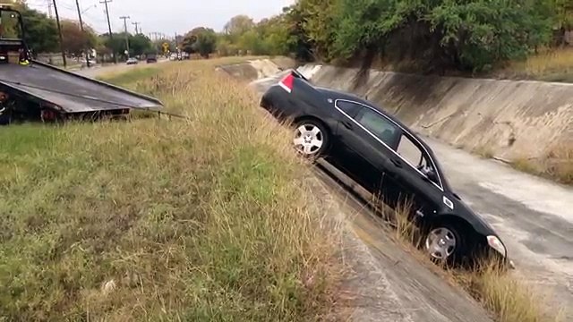 Tow Truck Driver Pulls Car Out Of Ditch