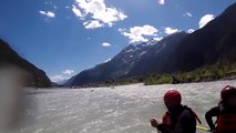 The grizzly bear chased the kayaker while rafting along the river