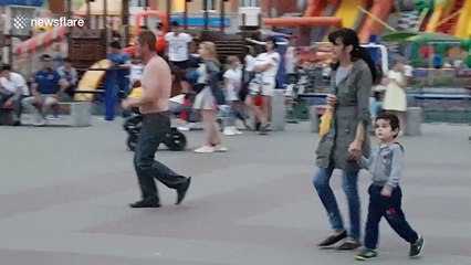 Russian man dances enthusiastically, strips to mark city day