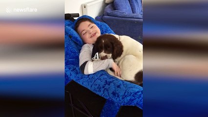 Heartwarming moment UK boy with rare condition bonds with puppy