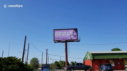 State anti-drunk driving campaign billboard says "Coloradans blow before driving"