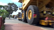 Tri Drive Mack Titan with a Caterpillar 785C dump truck