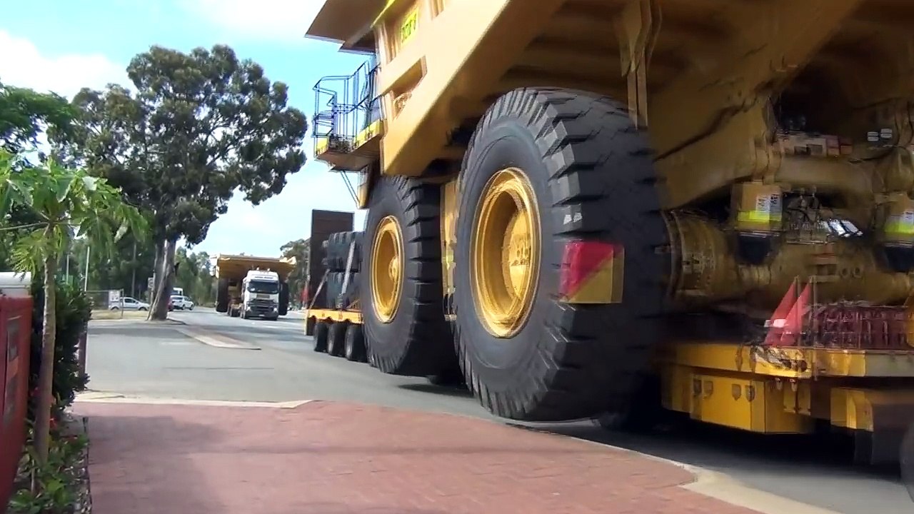 Tri Drive Mack Titan with a Caterpillar 785C dump truck