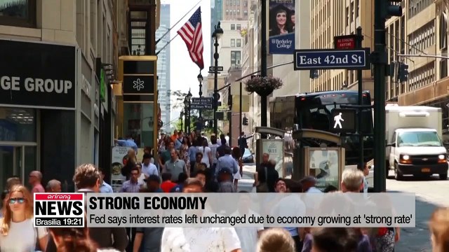 Fed holds interest rates, says economy is growing at a 'strong' pace