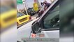 İranlı kadın, araba kullanırken başörtü takmayı reddeden hemcinsine saldırdı