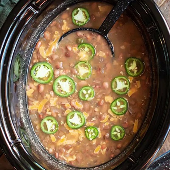 Slow Cooker Spicy Pinto Beans are a delicious side dish or great as the main meal with corn bread. Recipe: