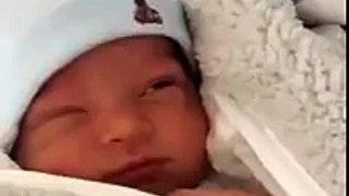 Newborn baby pretends to be asleep then laughs