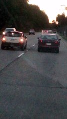 Two Cars Drive Together with Jumper Cable Attached