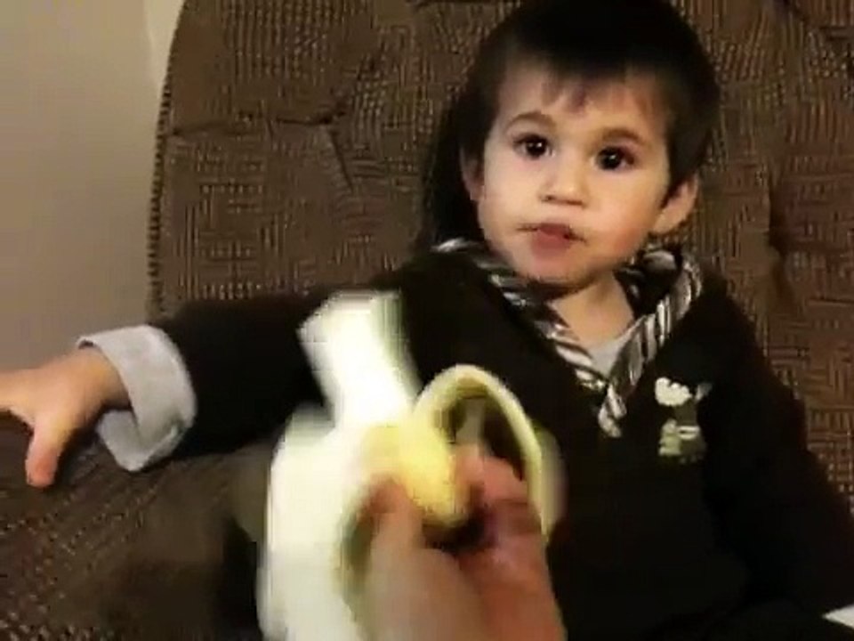 One year old baby eating banana