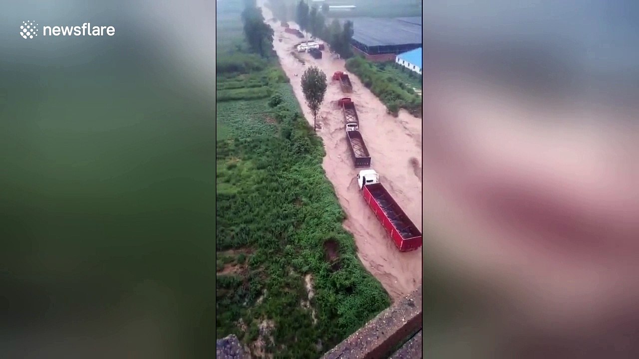 Dozens of lorries get trapped in flash floods