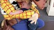 2-Year old boy meets Woody from 'Toy Story' for first time and just won’t let go