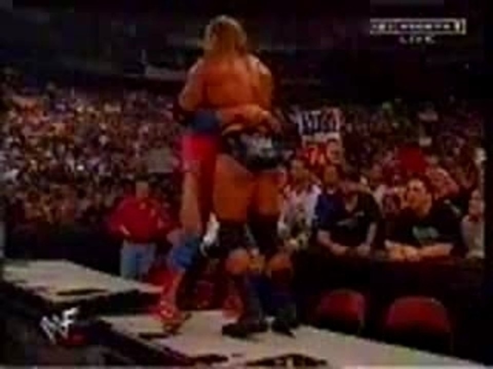 WWE Kurt Angle Belly To Belly Suplex On Announce Tables