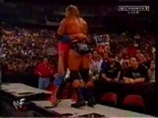 WWE Kurt Angle Belly To Belly Suplex On Announce Tables